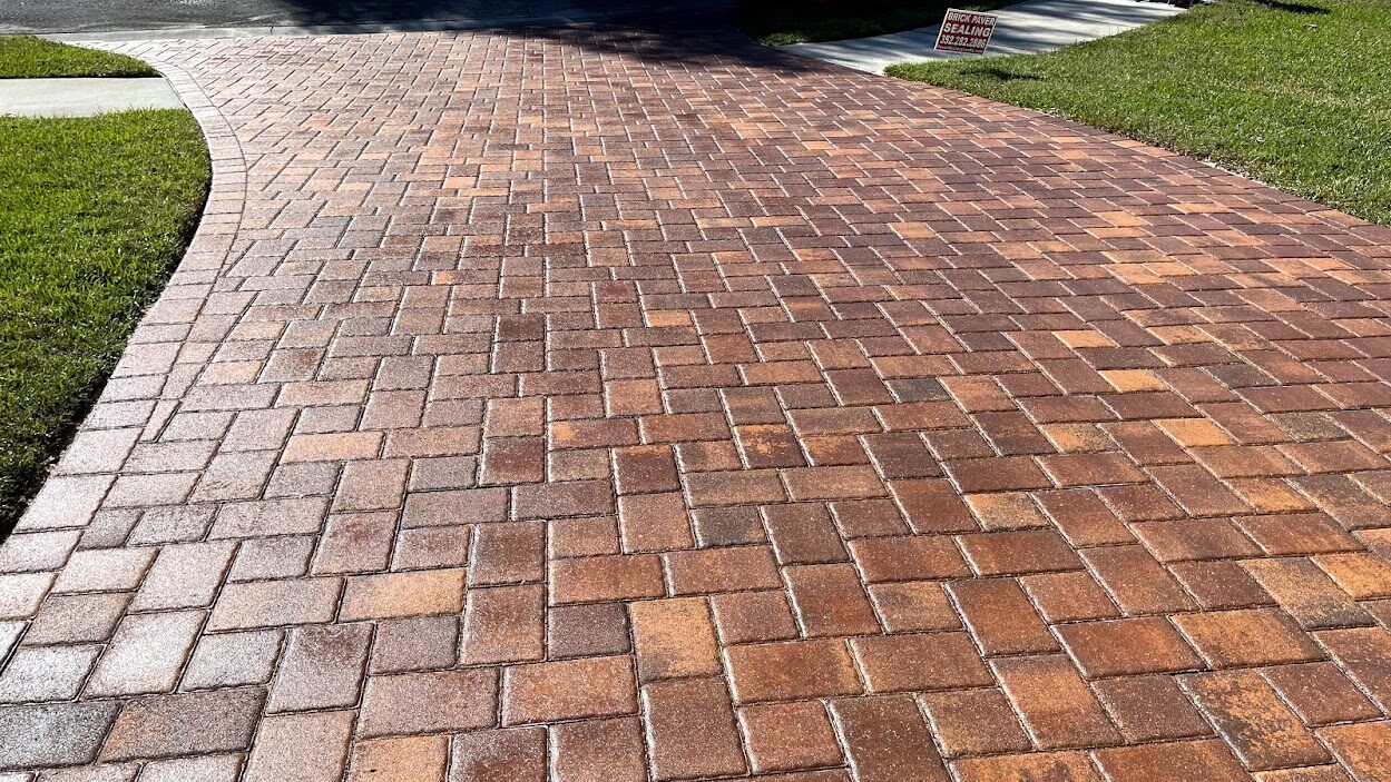 Freshly sealed glossy brick paver driveway in Bradenton, FL