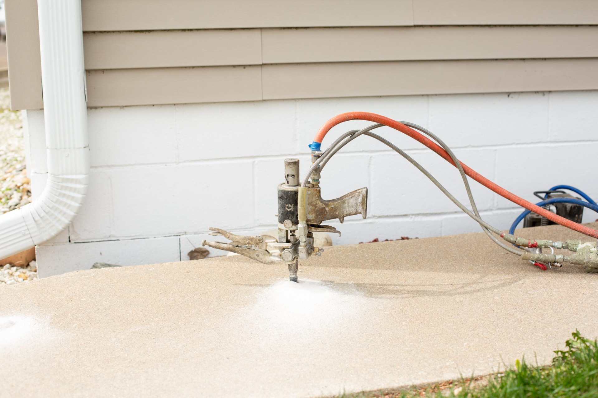 Polyurethane foam injection lifting a sunken concrete slab